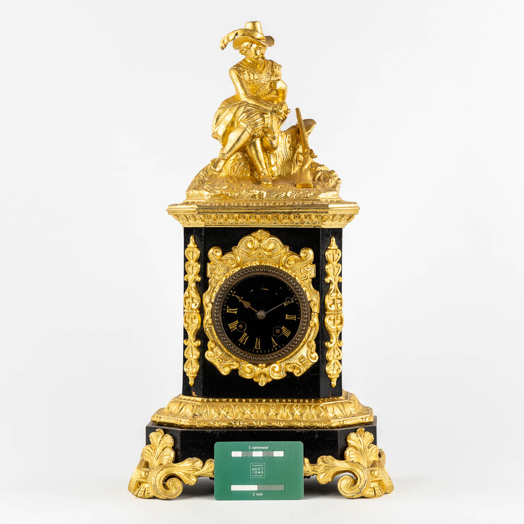 A mantle clock with a 'Hunter', gilt spelter mounted on ebonised wood. 19th C.