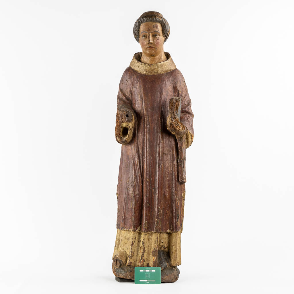 Saint Laurentius, Deacon. A wood-sculpture, oak, 14th C.  (L:20 x W:25,5 x H:90 cm)