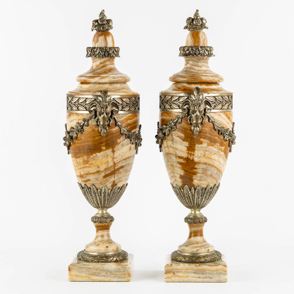 A pair of bronze mounted marble cassolettes with Ram