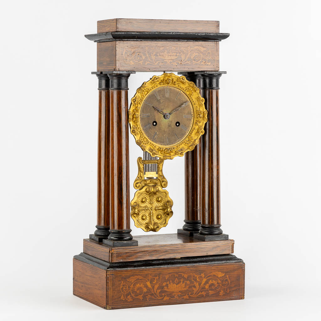 A column clock, marquetry inlay and gilt bronze. 19th C. (L:15 x W:25 x H:46 cm)