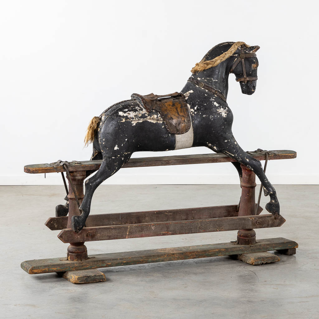 An antique 'Rocking Horse' with excellent patina. (L:43 x W:137 x H:107 cm)