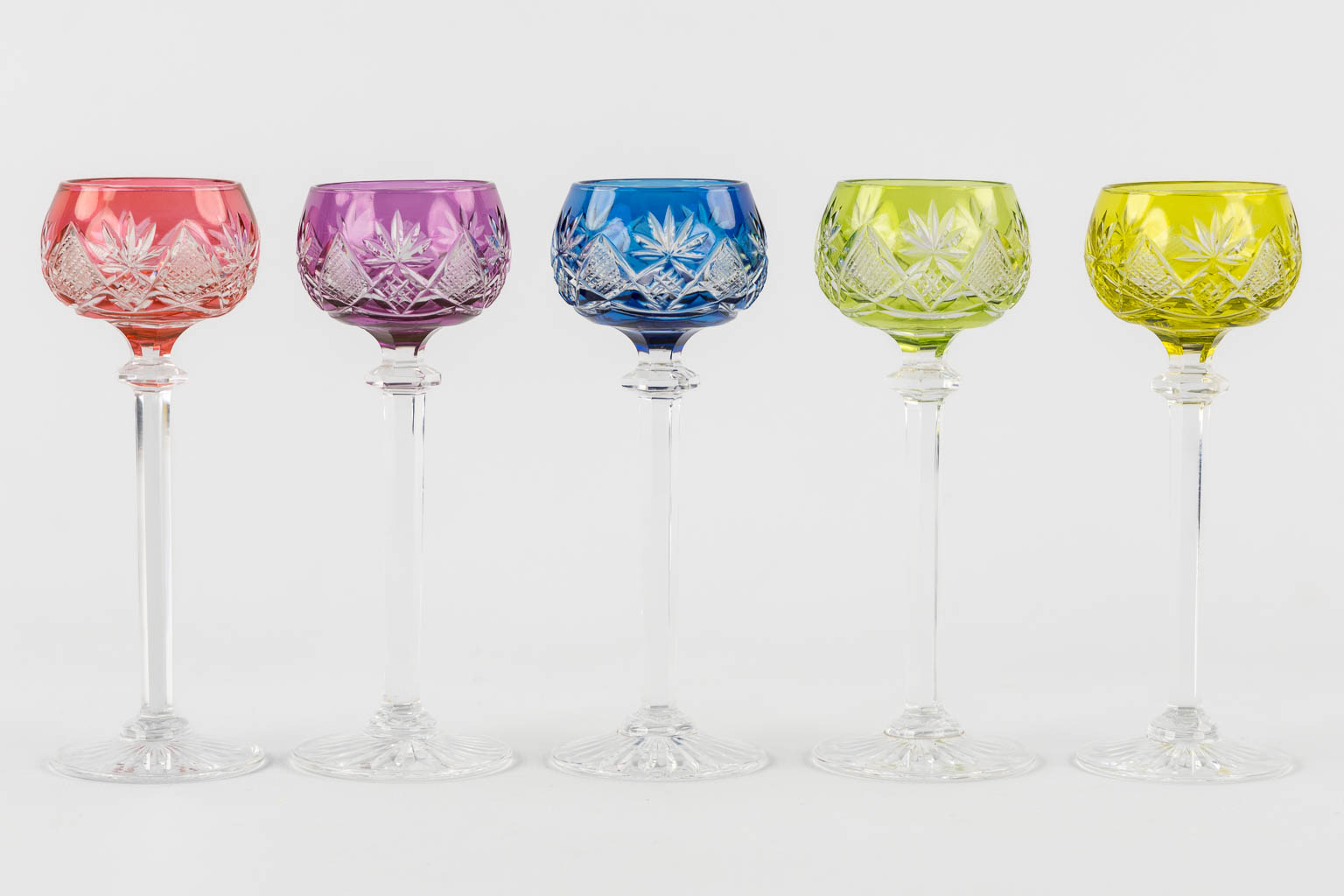 Val Saint Lambert, 36 coloured goblets and two carafes. 