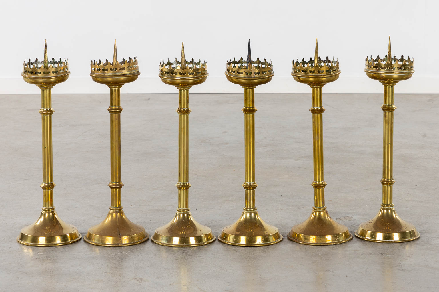 A set of 6 brass church candelsticks, Gothic Revival. (H:55 cm)