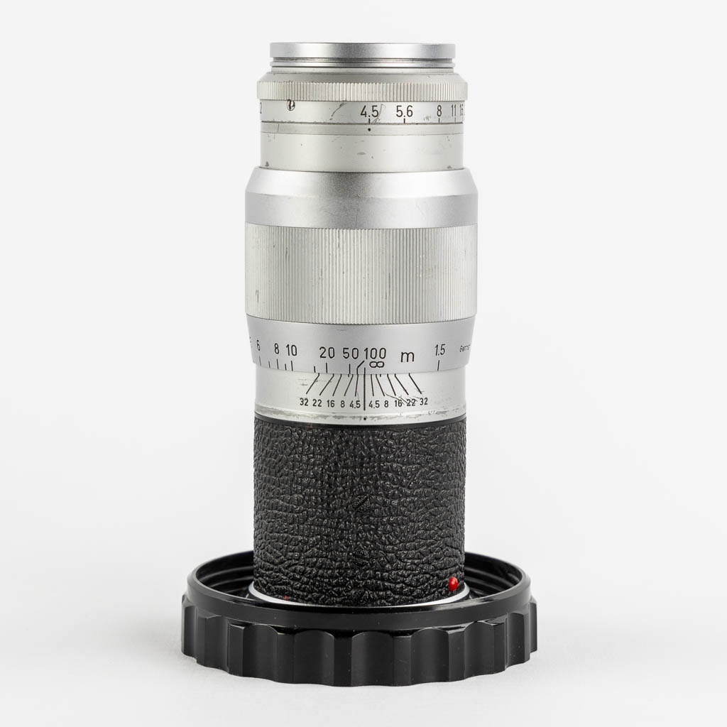 Leica, vier lenzen, en twee filters. (H:15,5 cm)