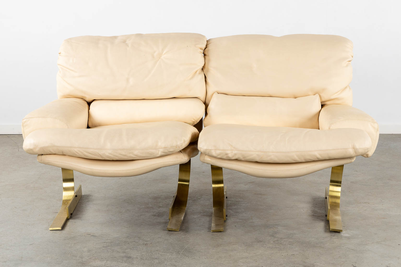 Zani Collection, Italy. A leather and gilt metal salon suite. (L:110 x W:175 x H:83 cm)