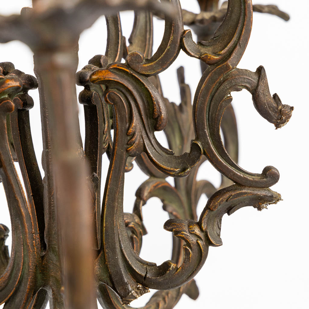 A three-piece mantle garniture clock and candelabra, spelter mounted on marble. Circa 1900. (L:28 x W:42 x H:77 cm)