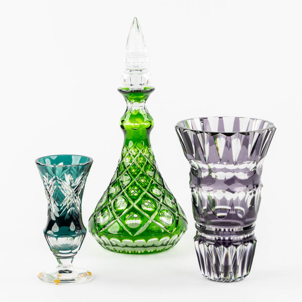 Val Saint Lambert, two vases, added a carafe. Cut and coloured crystal. (H:39,5 cm)