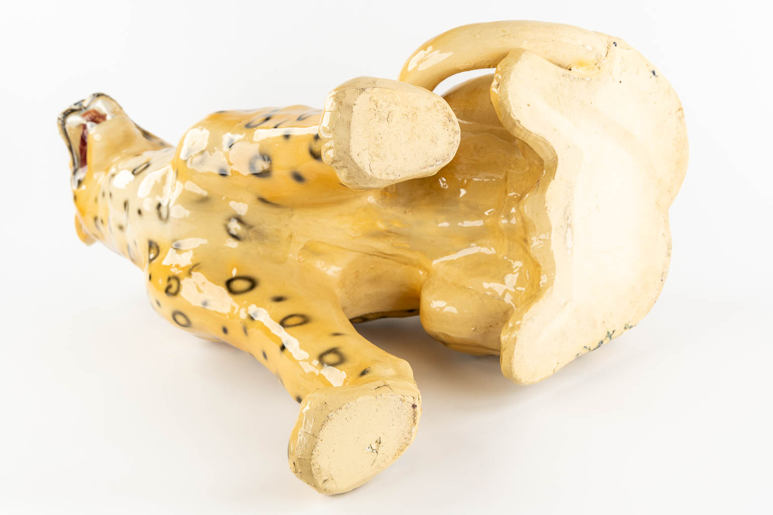 A large glazed faience Leopard, Italy, 20th C. (L:33 x W:46 x H:73 cm)