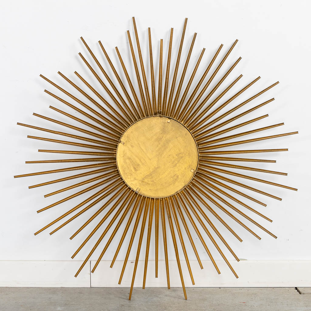 Chaty Vallauris, a sunburst mirror. Gilt metal. (D:70 cm)