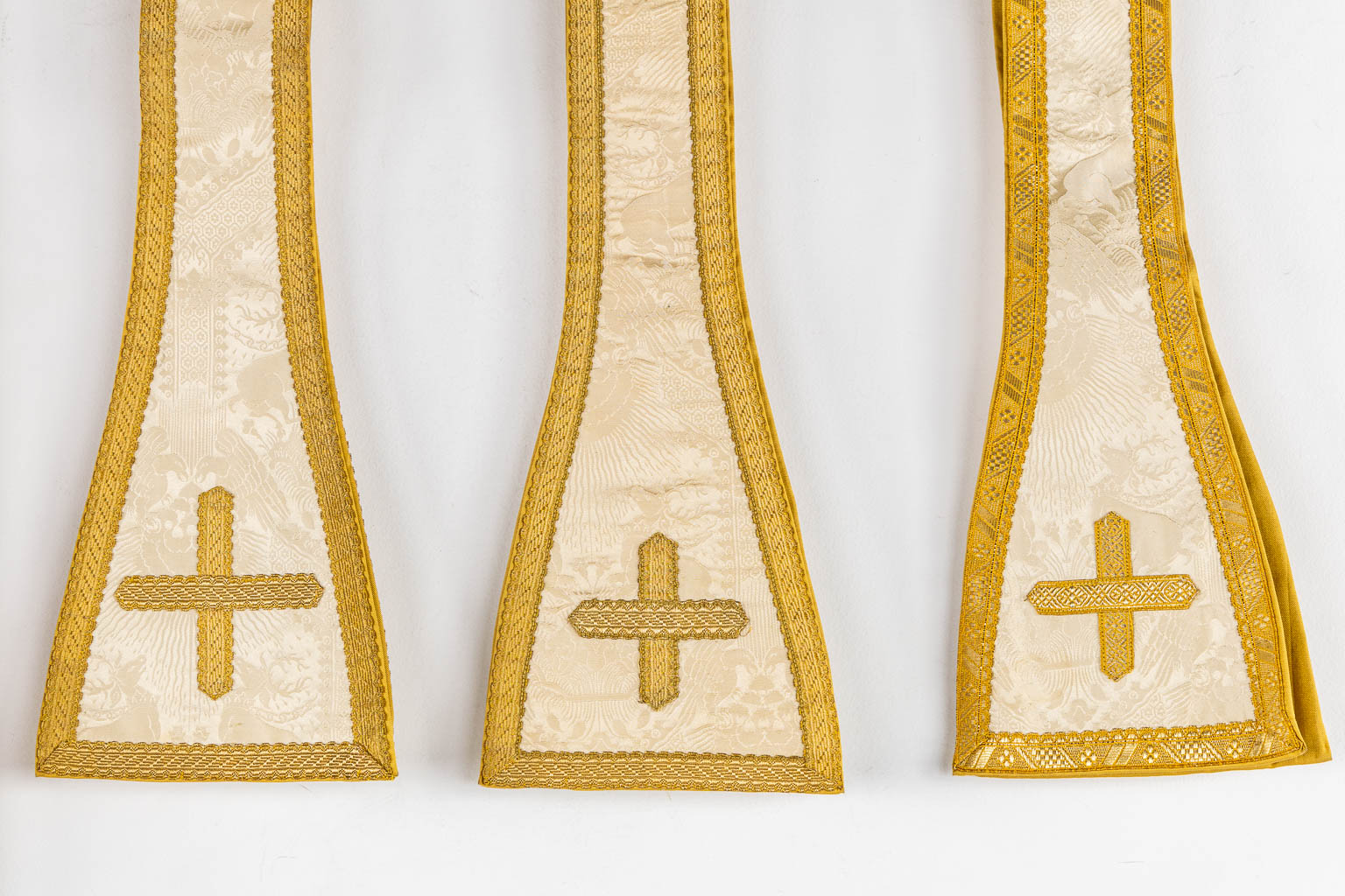 A pair of Dalmatics and a Cope, Thick Gold Thread Embroideries and Cabochons. 