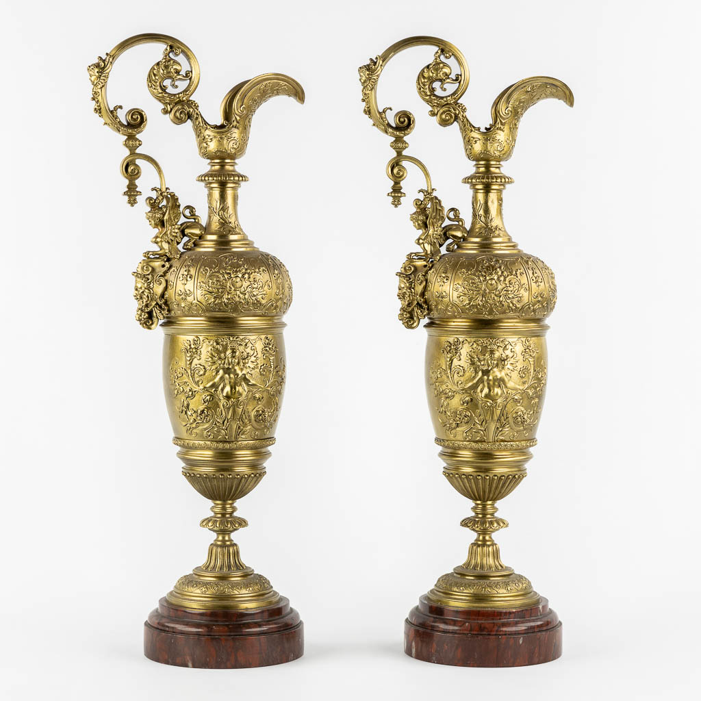 A large pair of pitchers, in the style of Ferdinand Barbedienne. 19th C. (L:15 x W:21 x H:59 cm)