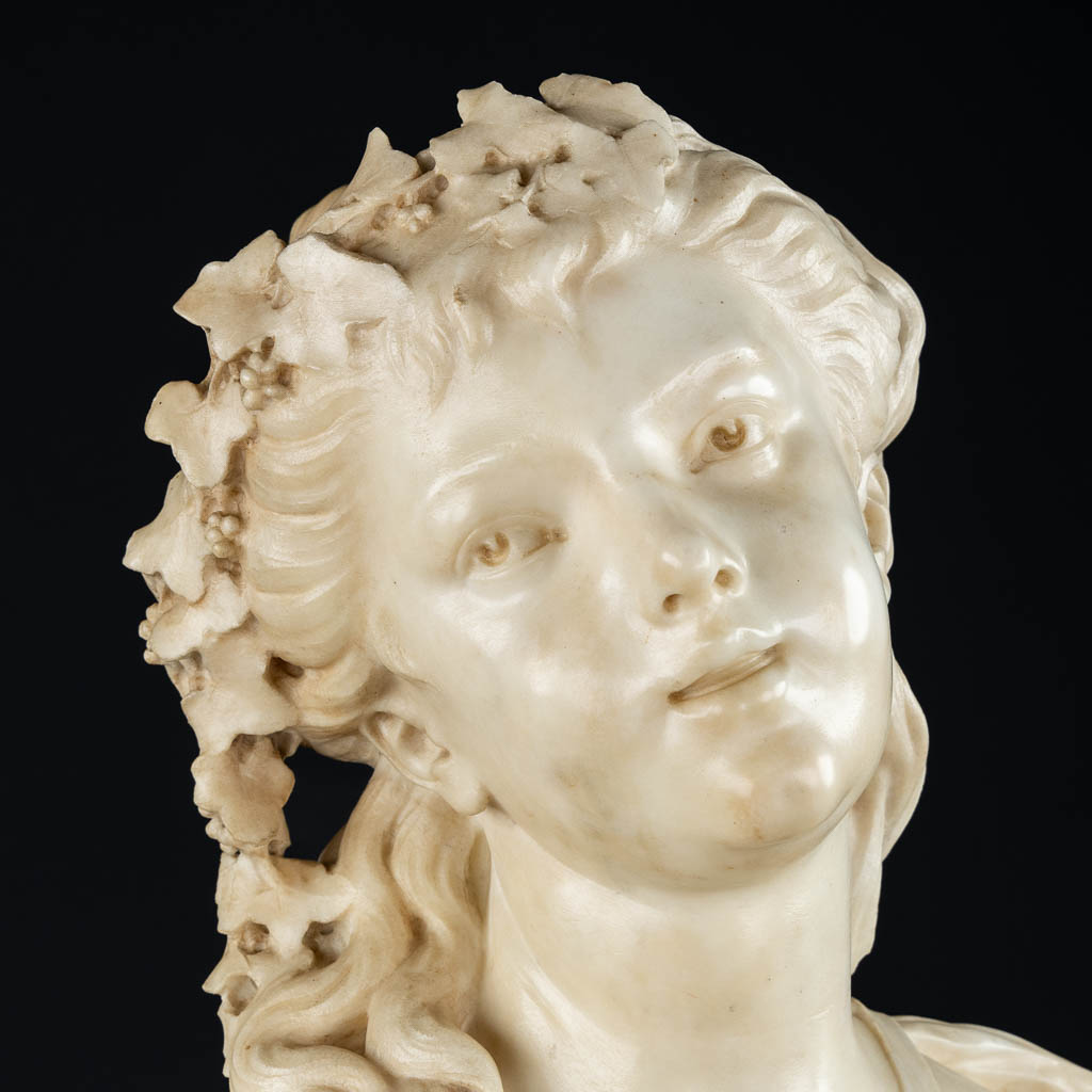 An elegant bust of a half-naked lady, sculptured marble. 19th C. (L:26 x W:45 x H:64 cm)