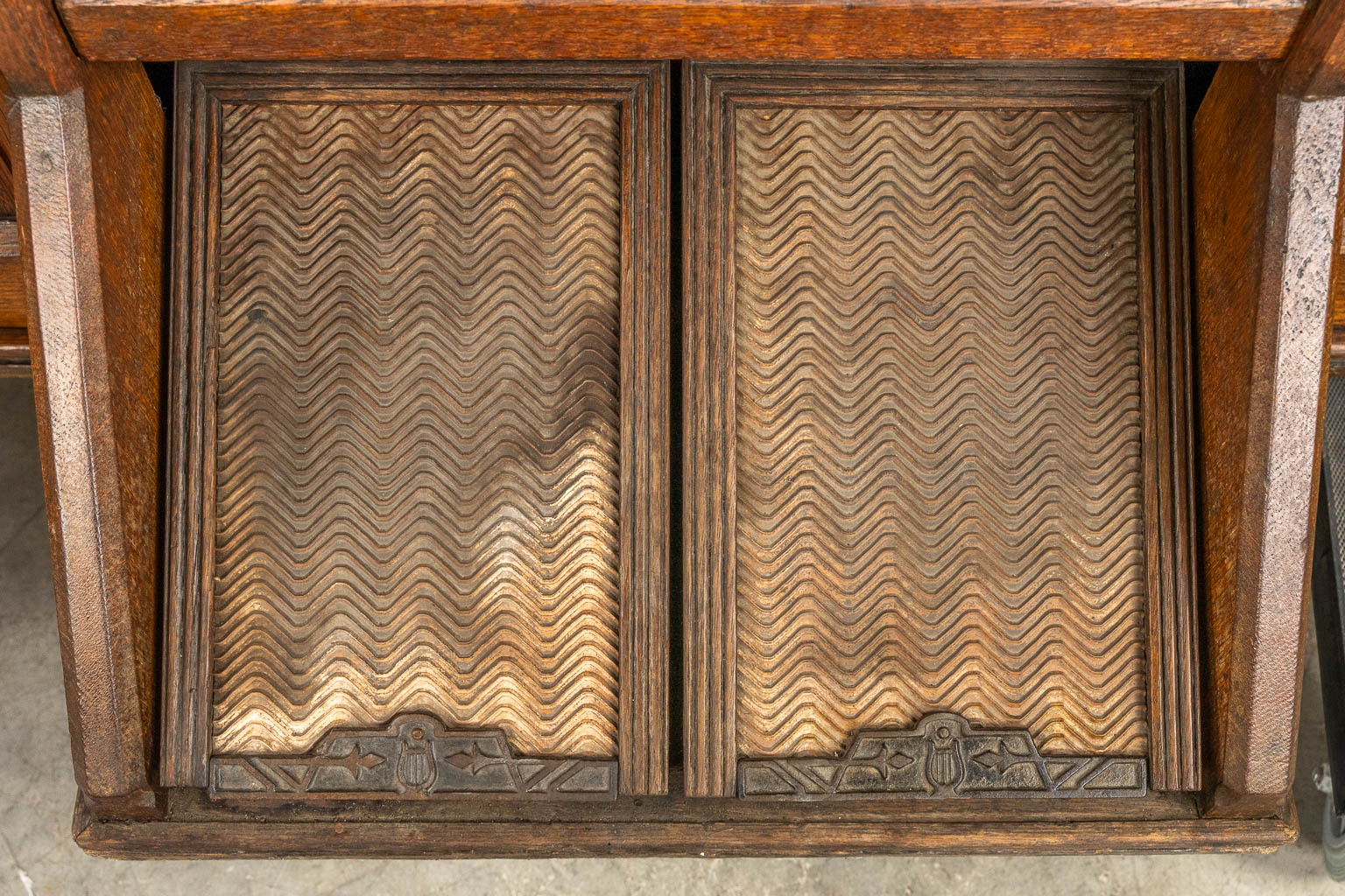 An antique organ, sculptured wood in Gothic Revival style. Circa 1900.