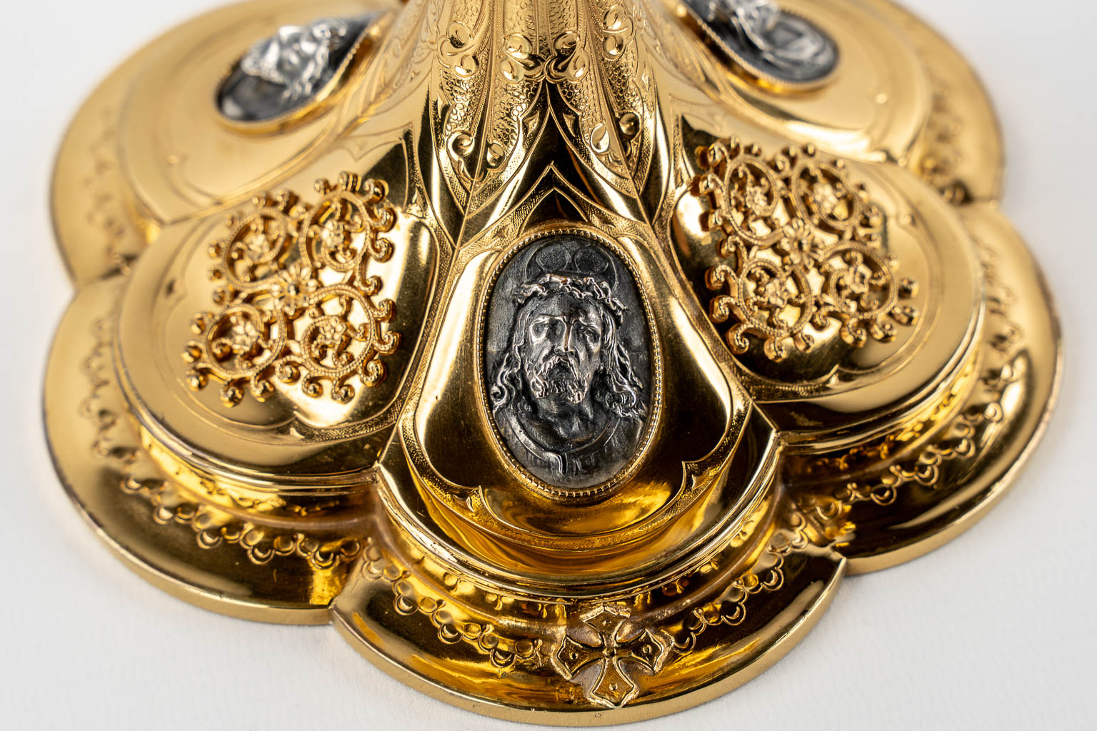 A Gothic Revival chalice with enamel plaques, cabochons. Silver Cuppa, Gilt brass, 19th C.