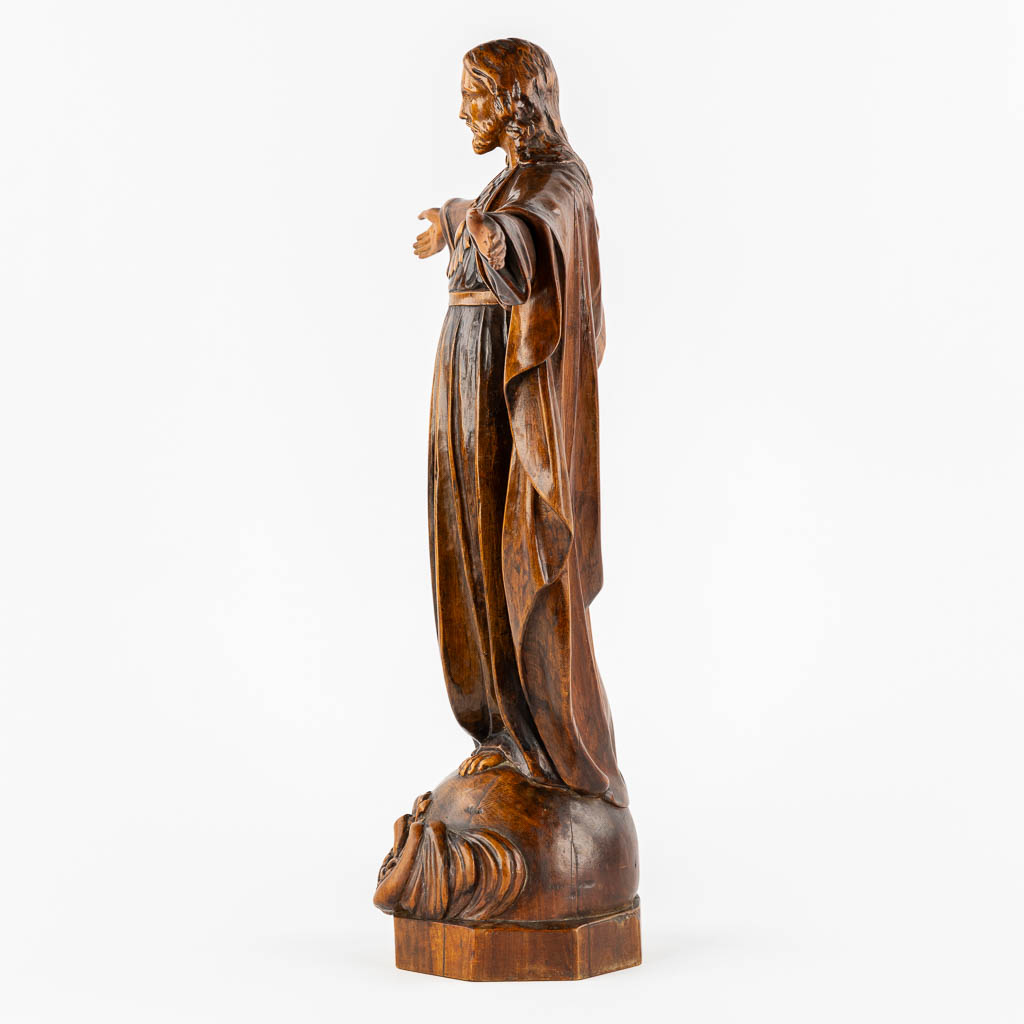 An antique wood sculpture of 'Jesus Christ The Redeemer'.