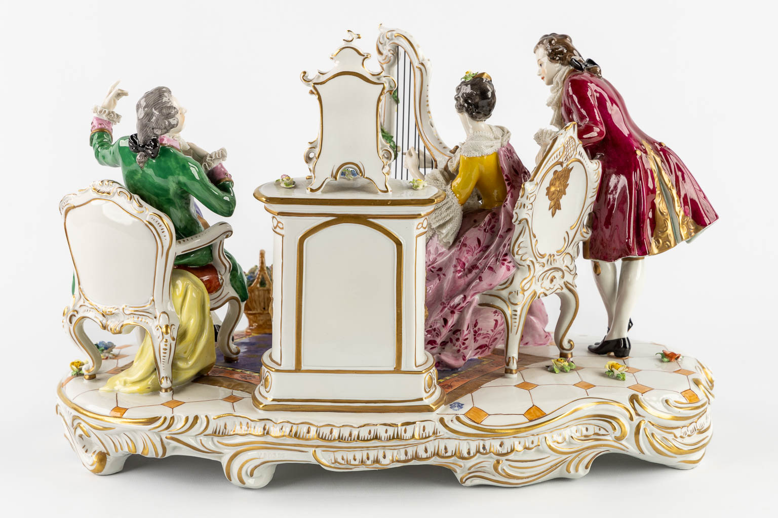 Volkstedt Rudolstadt, a large group 'Playing the harp' polychrome porcelain. 