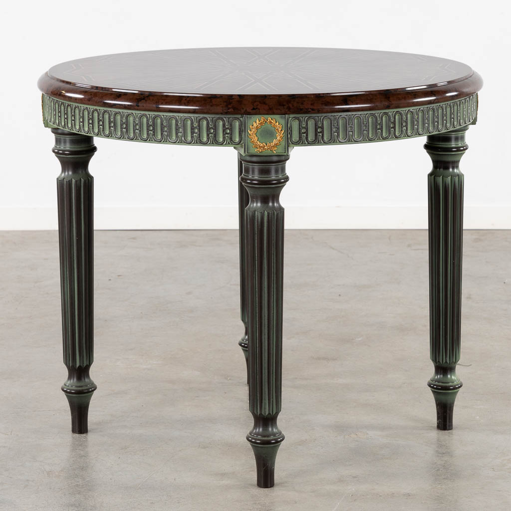 A decorative table with geometric pattern, Louis XVI style base.