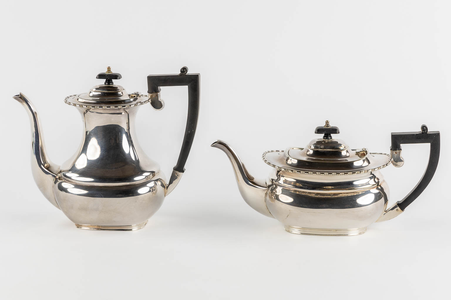 A 5-piece coffee and tea service, Silver-Plated, Sheffield UK. (L:38 x W:59 cm)