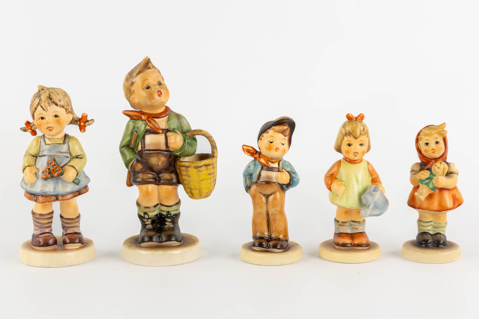 Hummel, 14 figurines, some with original boxes. (H:19 cm)