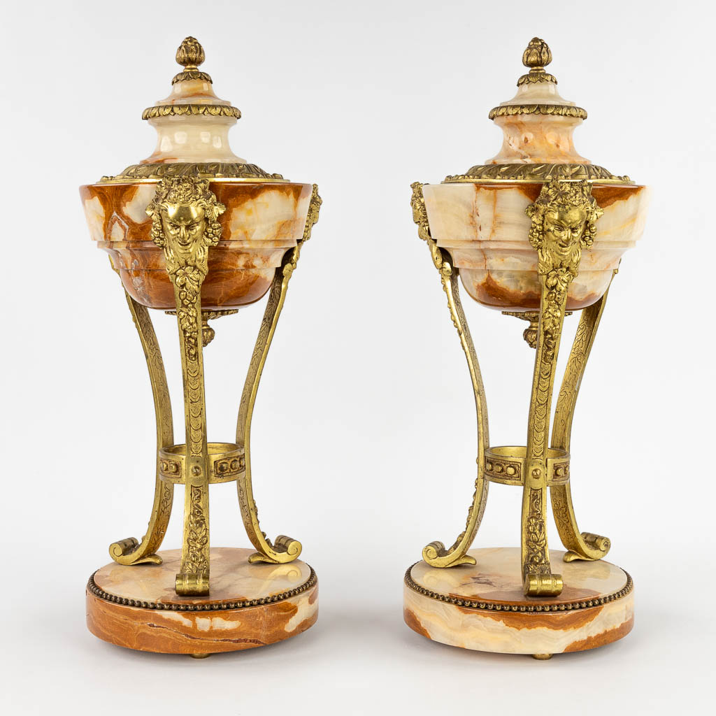 A pair of cassolettes, onyx mounted with bronze in Louis XVI style. Circa 1900. (H:45 x D:18 cm)