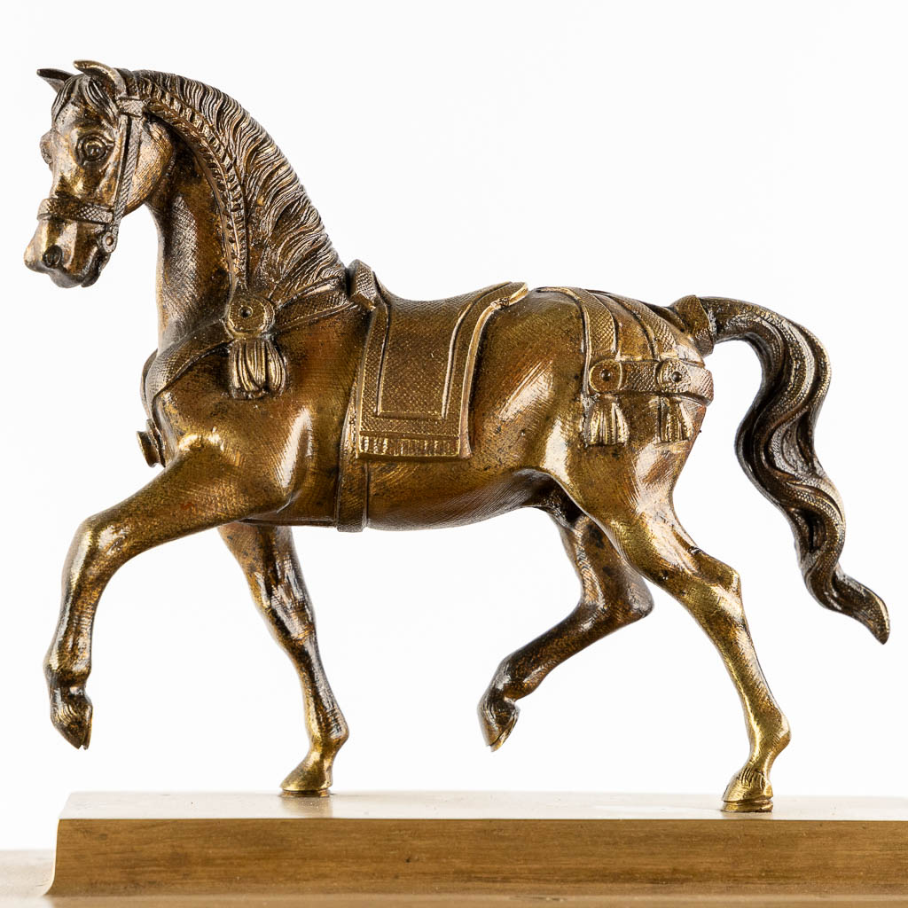 An antique column clock, bronze with a horse figurine. 19th C. (L:18 x W:27 x H:62 cm)