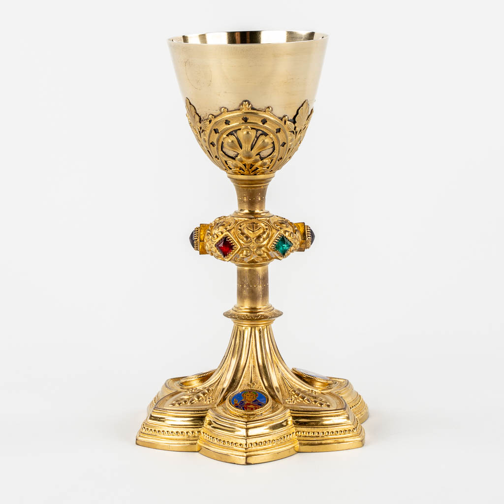 A Gothic Revival chalice with enamel plaques, cabochons. Silver Cuppa, Gilt brass, 19th C.