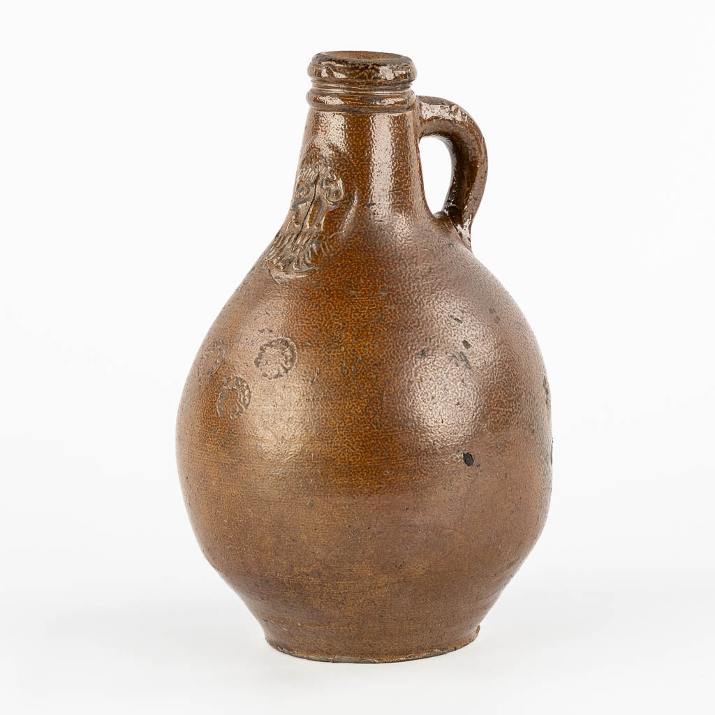 An antique Bartmann jug with three stamps, 17th C. (H:27 x D:17 cm)