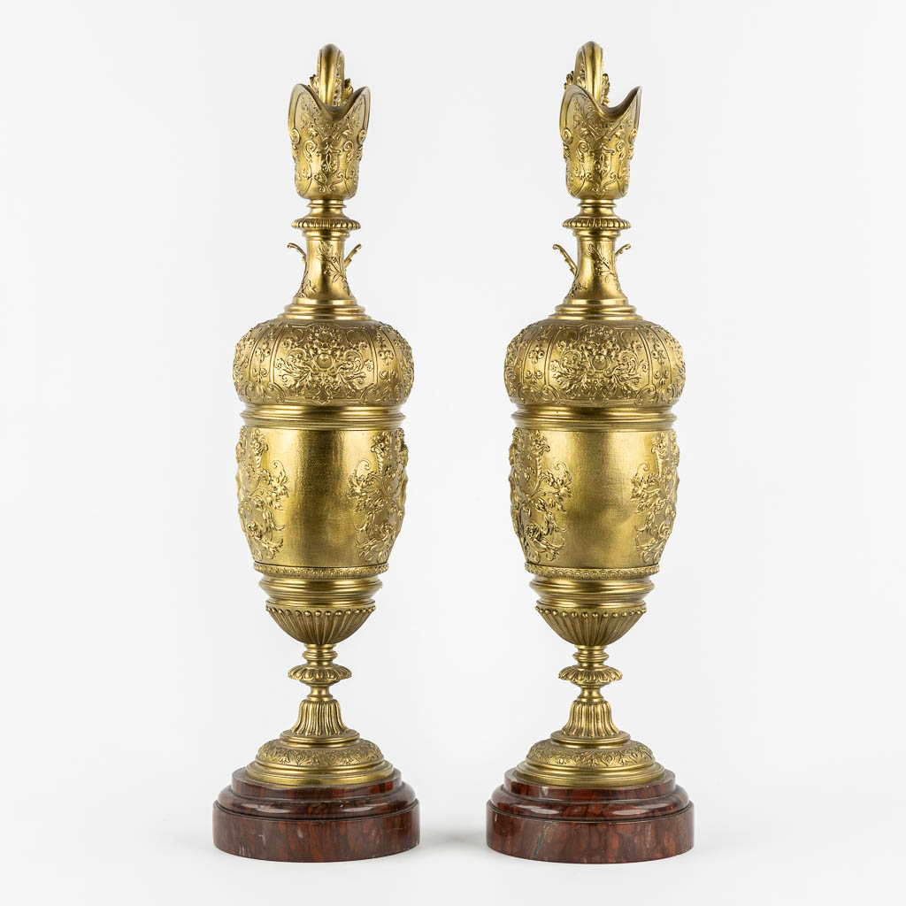 A large pair of pitchers, in the style of Ferdinand Barbedienne. 19th C. (L:15 x W:21 x H:59 cm)