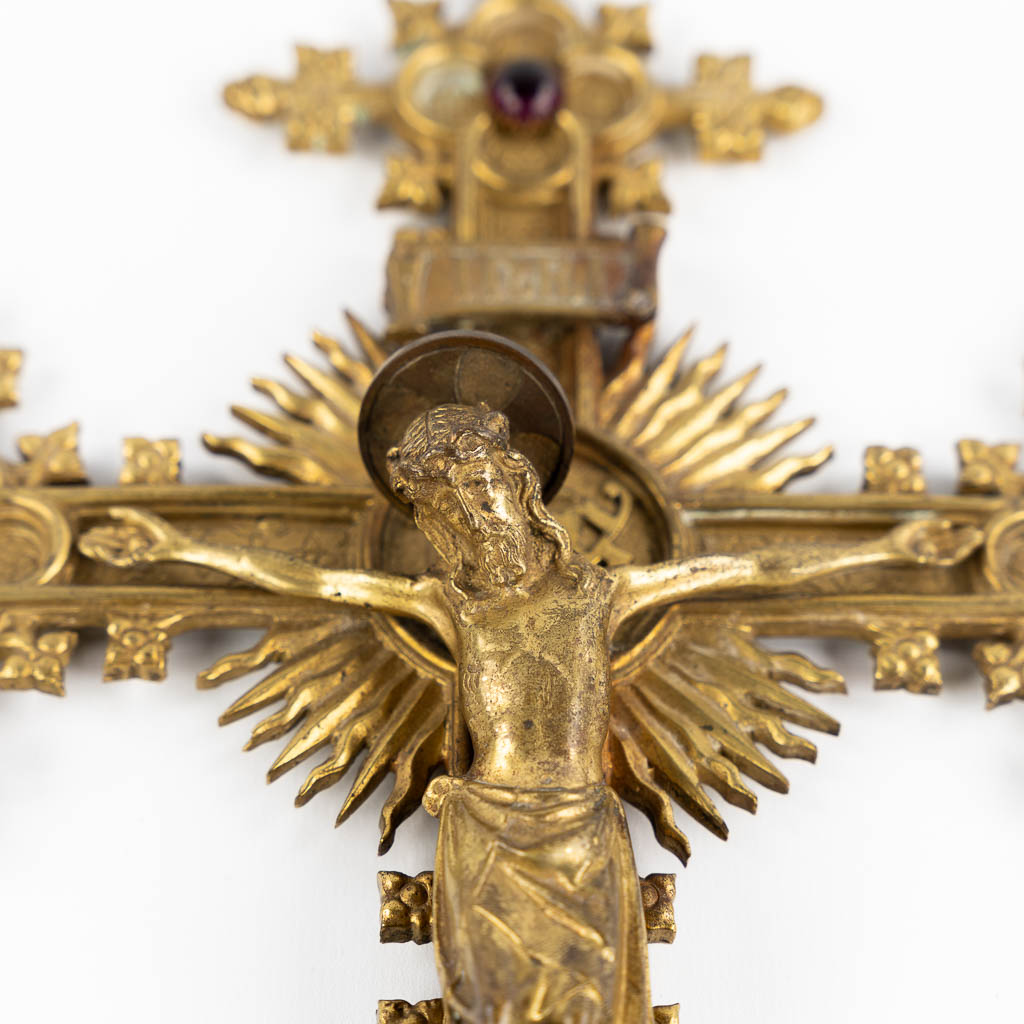 A crucifix, brass with cabochons, Gothic Revival. Circa 1900.