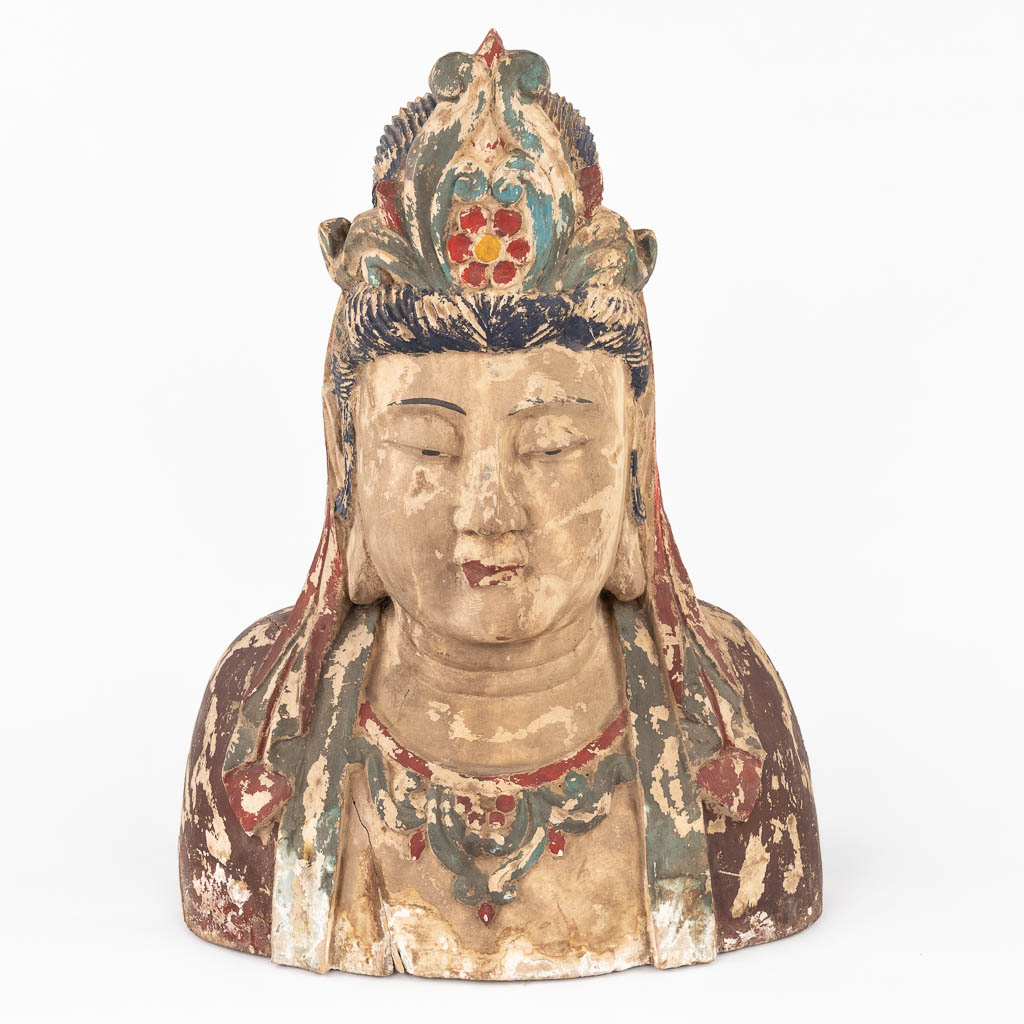 A large and antique wood sculptured buste of Guanyin. (L:28 x W:50 x H:69 cm)