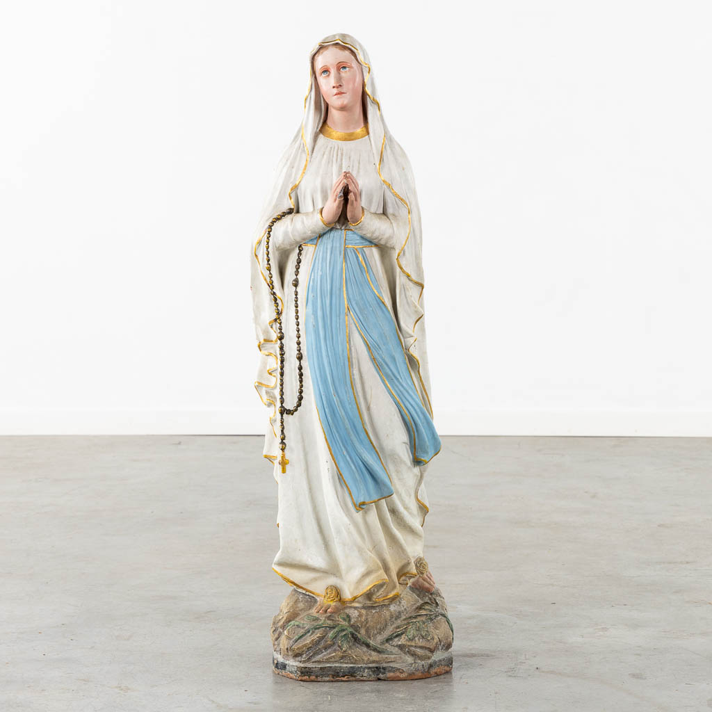 A patinated terracotta figurine of Our Lady of Lourdes. 19th C. (H:110 cm)