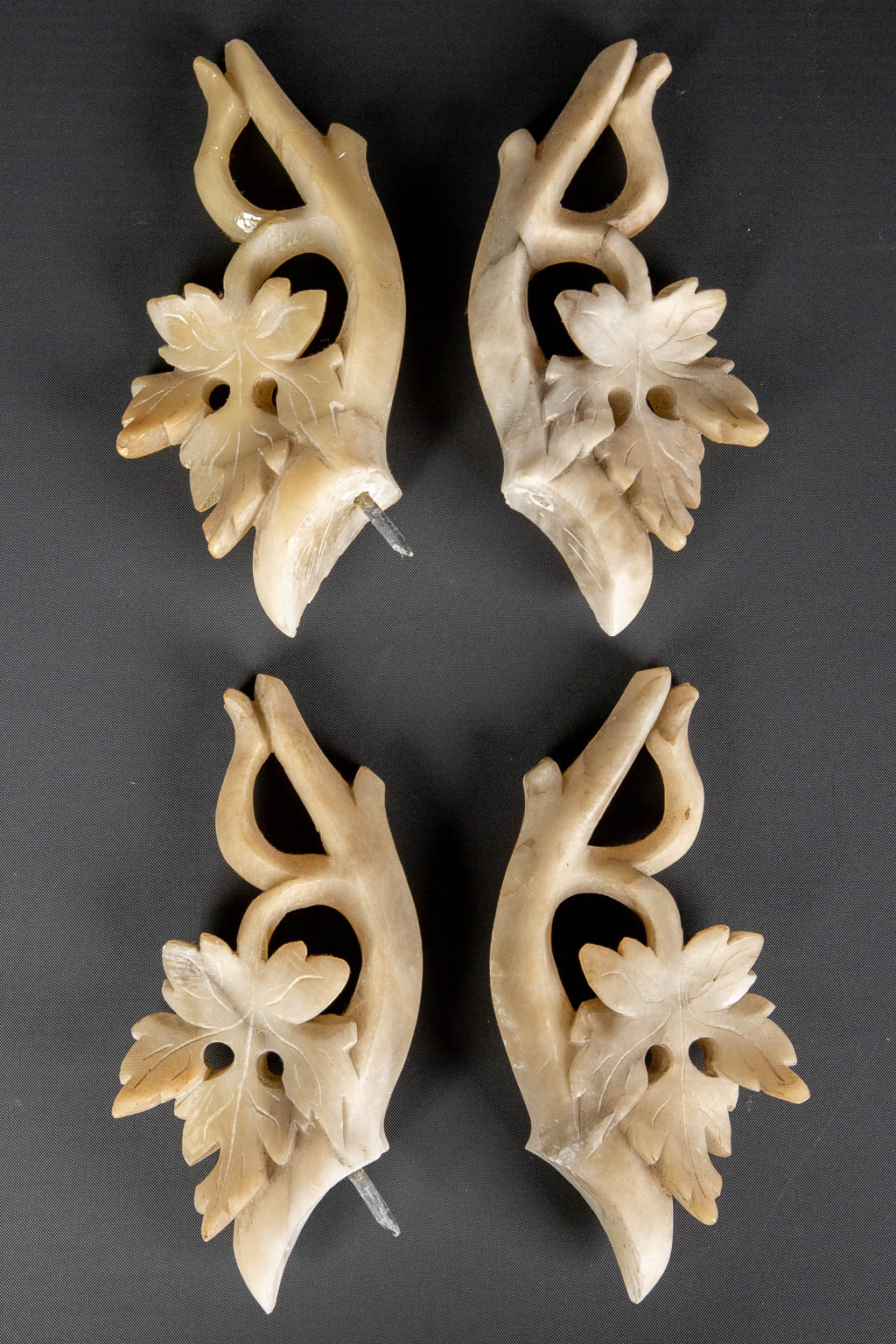 A three piece mantle garniture set, sculptured alabaster. (H:45 x D:15 cm)