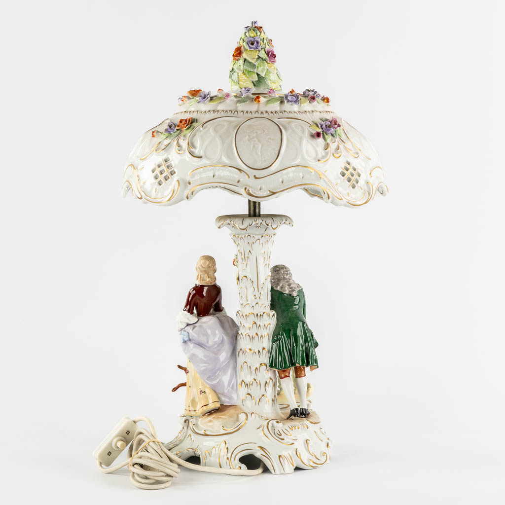 PMP, A polychrome porcelain table lamp, 20th C. (H:56 x D:34 cm)