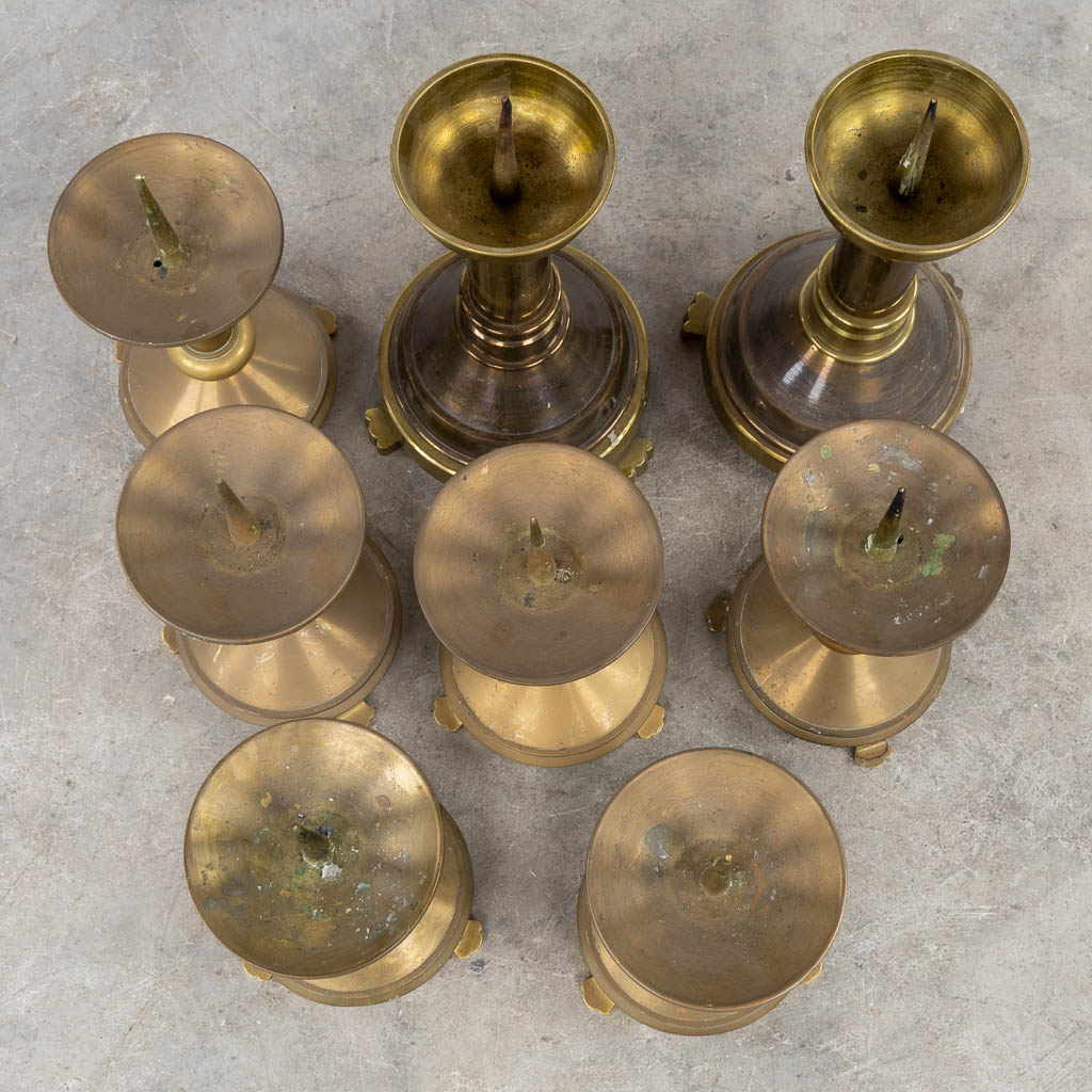 Thirteen Chruch candlesticks, brass and bronze. (H:40 cm)