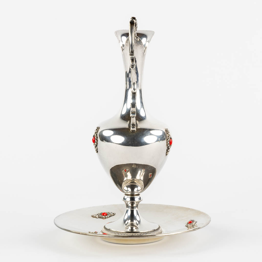 A pitcher on a saucer, silver mounted with cabochons. 800/1000. (H:22 x D:16 cm)