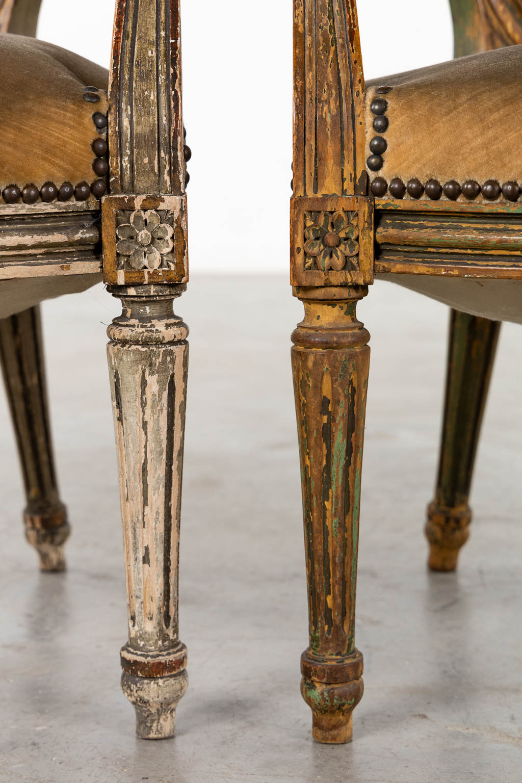 A pair of antique patinated chairs, Louis XVI style. (L:58 x W:57 x H:83 cm)