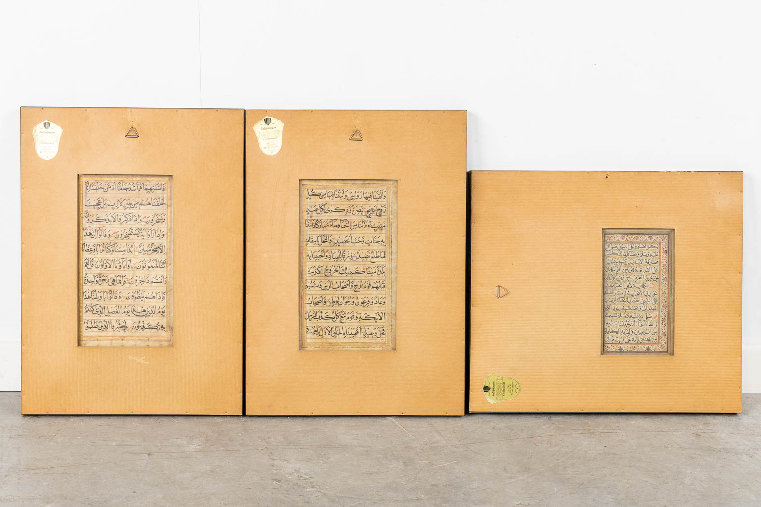 Persian/Indian/Moghul School, three framed and Illuminated manuscripts.