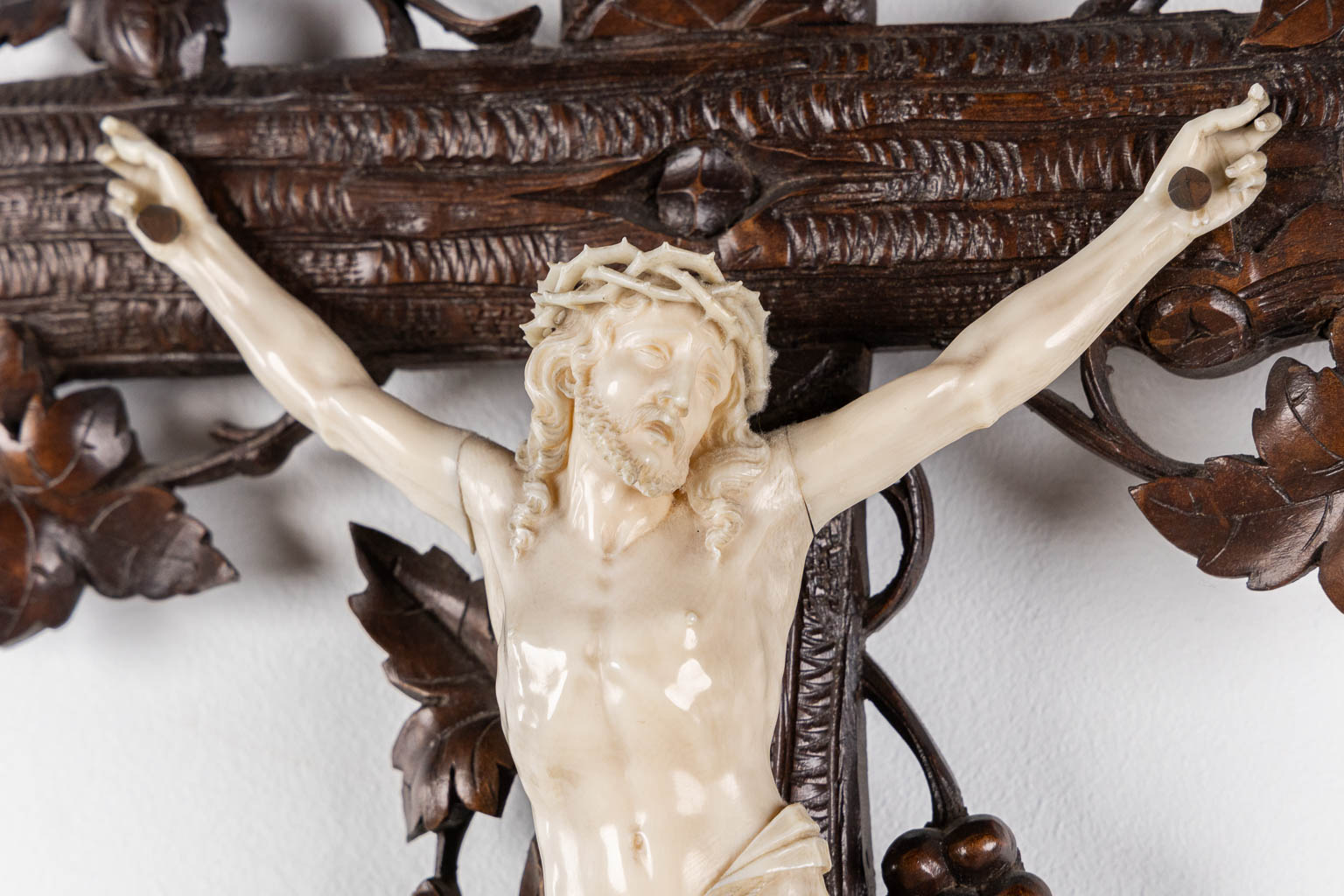 A wood-sculptured crucifix with an ivory 