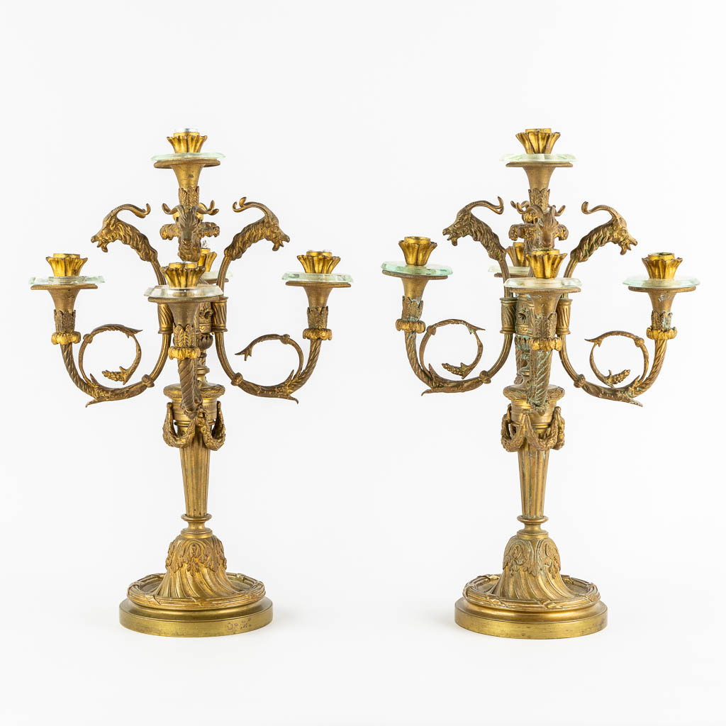 A pair of gilt bronze candelabra, mounted with crystal in a Louis XVI style. Circa 1900. (H:51 x D:34 cm)