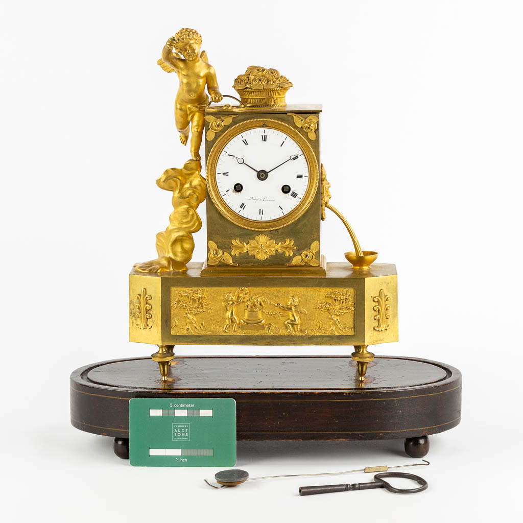 A mantle clock, Gilt bronze, Empire, 