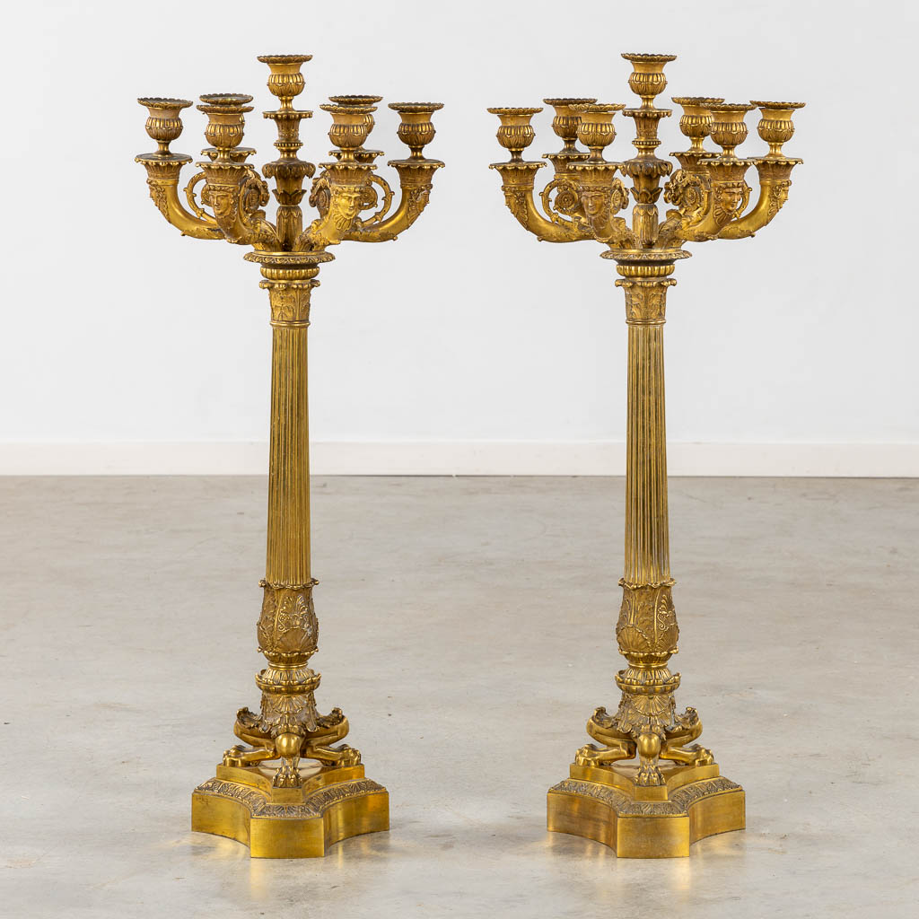  An exceptional pair of candelabra, gilt bronze in Empire style. 