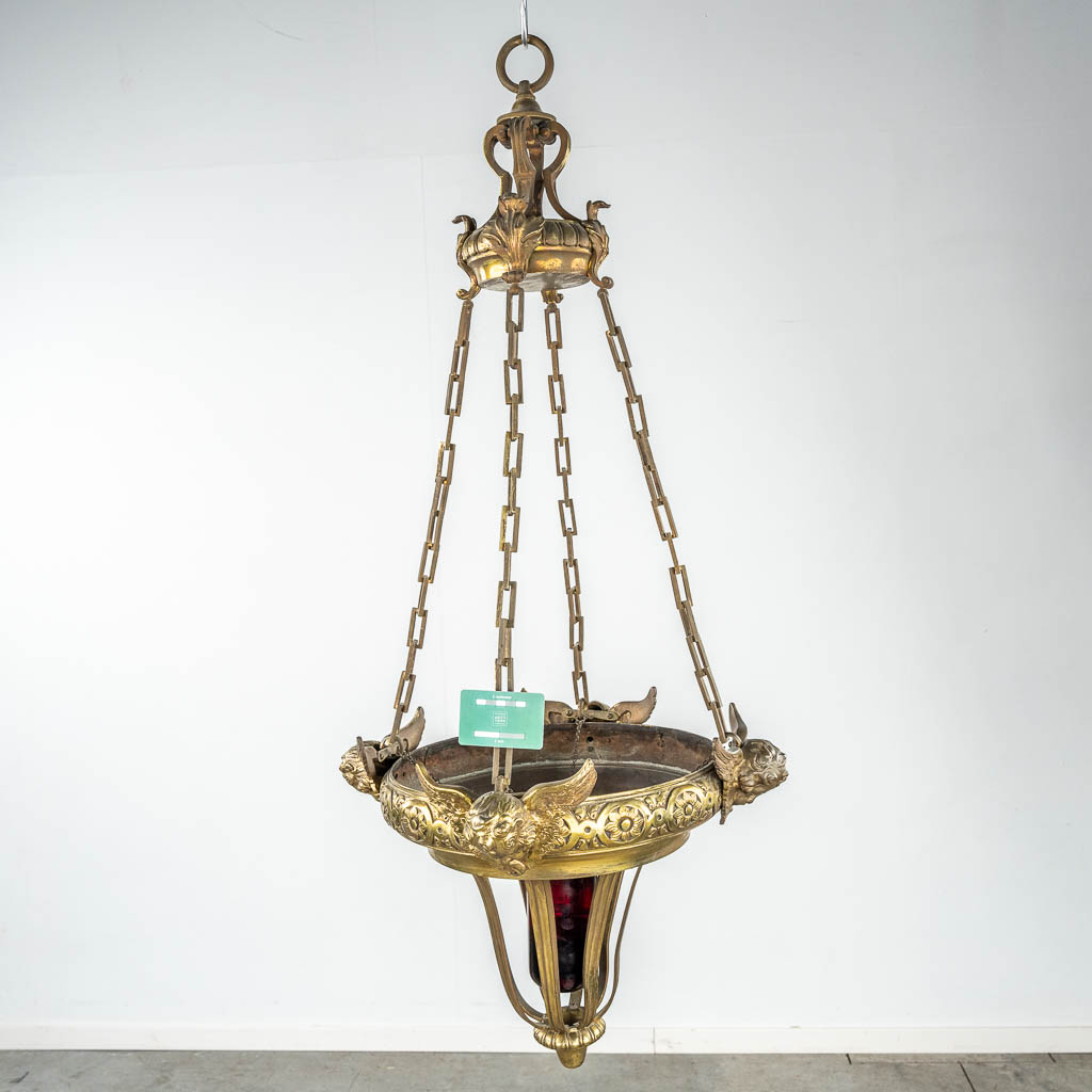 An antique and bronze eternal light, decorated with angels. 19th C. (H:115 x D:55 cm)