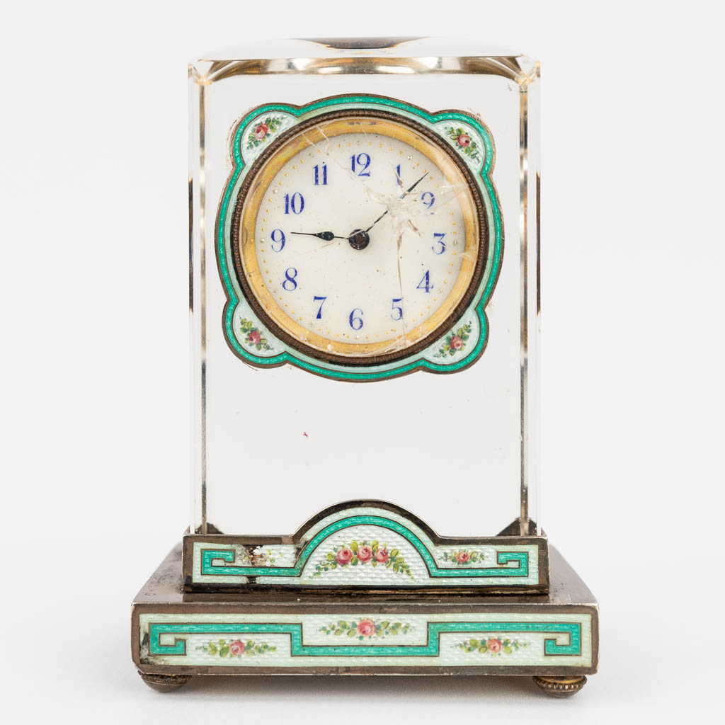 An antique table clock made of glass and finished with green enamel and cloisonné. (L:4 x W:6 x H:8,5 cm)