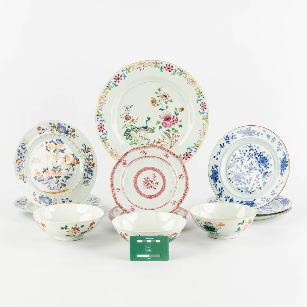 Twelve Chinese Famille Rose and Blue-white plates and bowls. 19th/20th C. (D:29 cm)