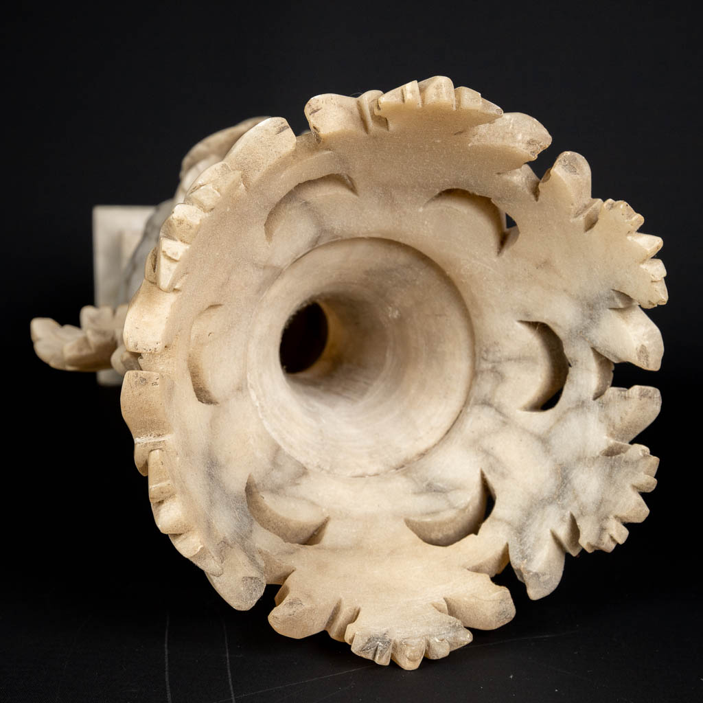 A three piece mantle garniture set, sculptured alabaster. (H:45 x D:15 cm)