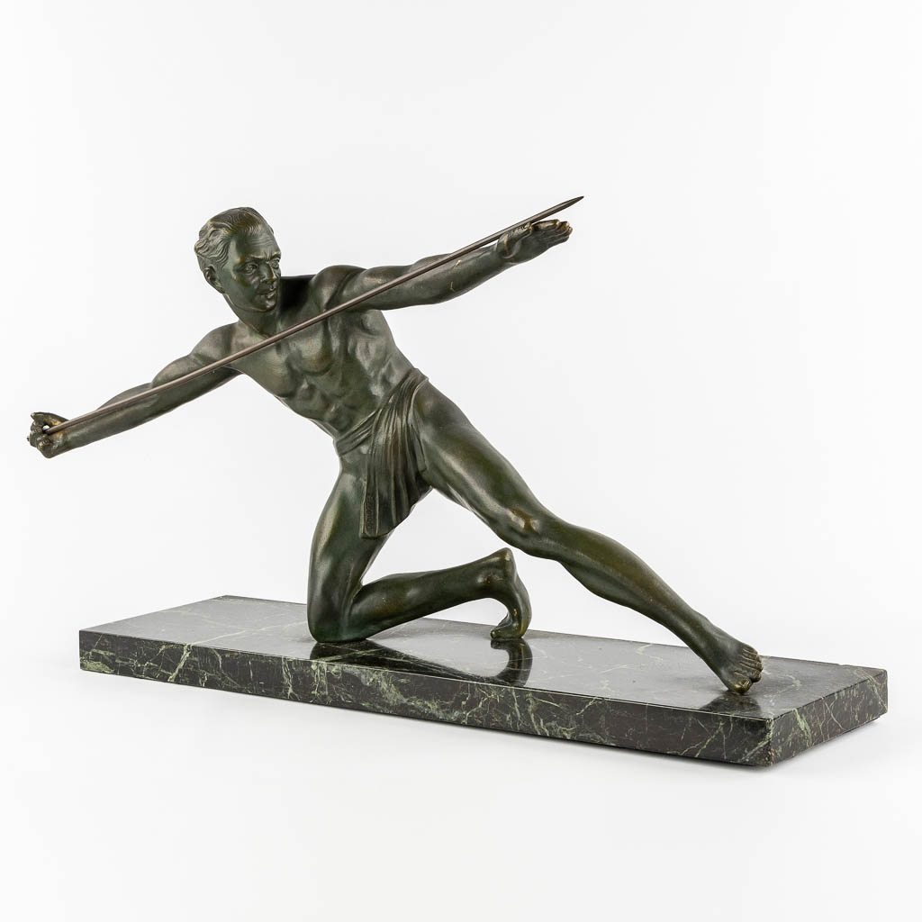 An Art Deco 'Spear Thrower', bronze mounted on marble. Signed Secondo. (L:23 x W:75 x H:46 cm)