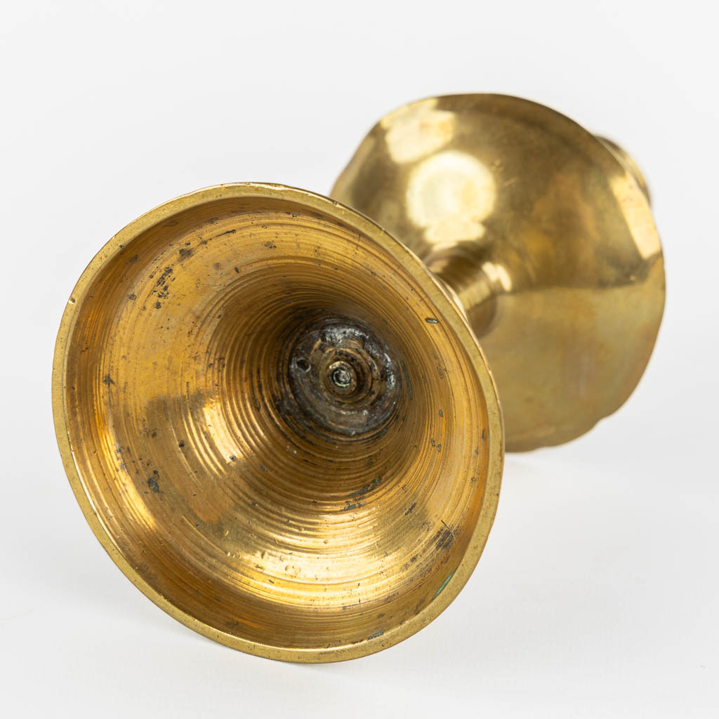 A brass disk candlestick, so-called 