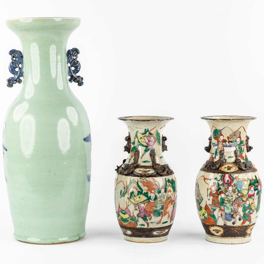 A Chinese vase blue-white decor of the Eight Immortals, added a pair of Nanking vases. (H:61 x D:23 cm)