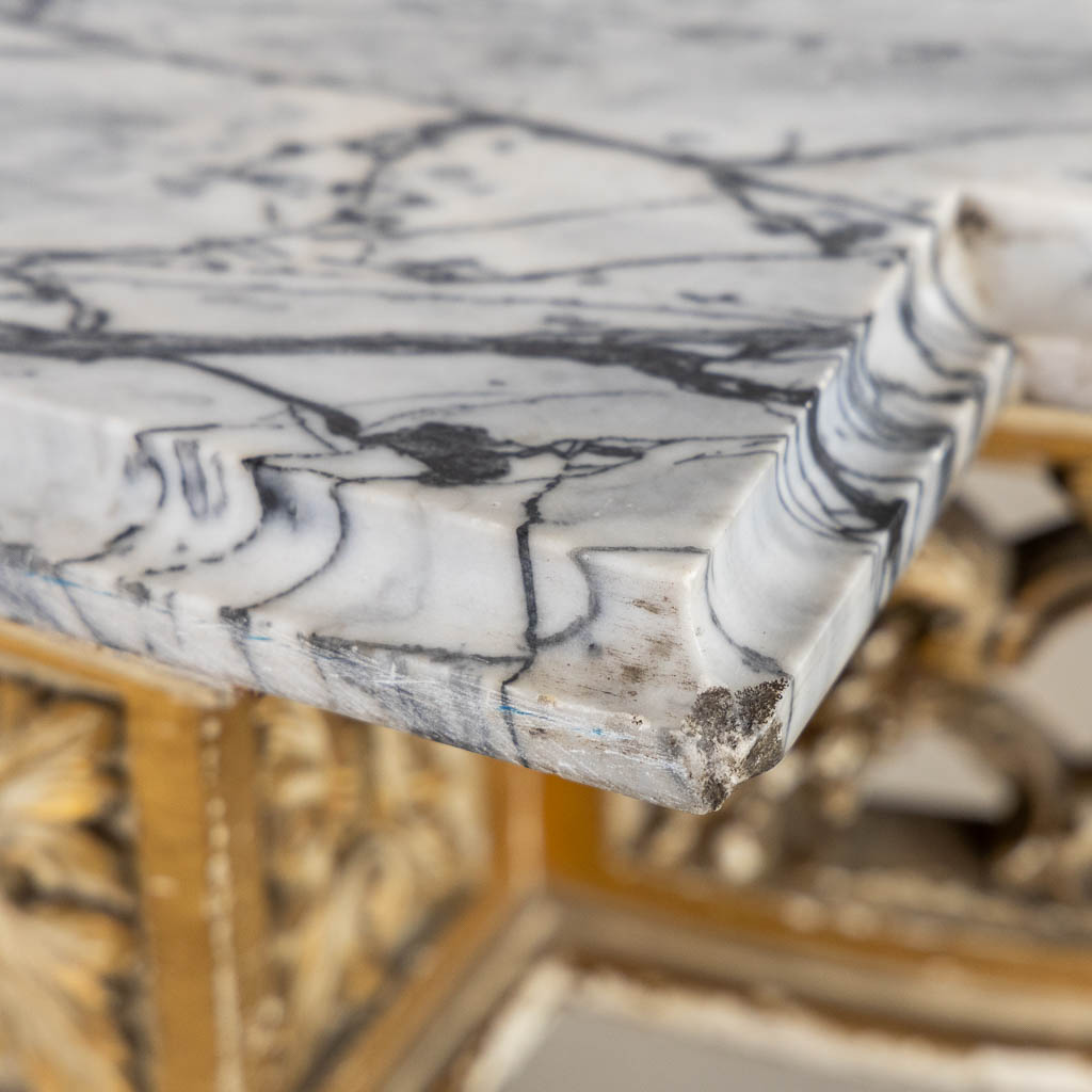 A wood-sculptured and patinated table with a grey marble, Louis XVI style. (L:65 x W:112 x H:80 cm)