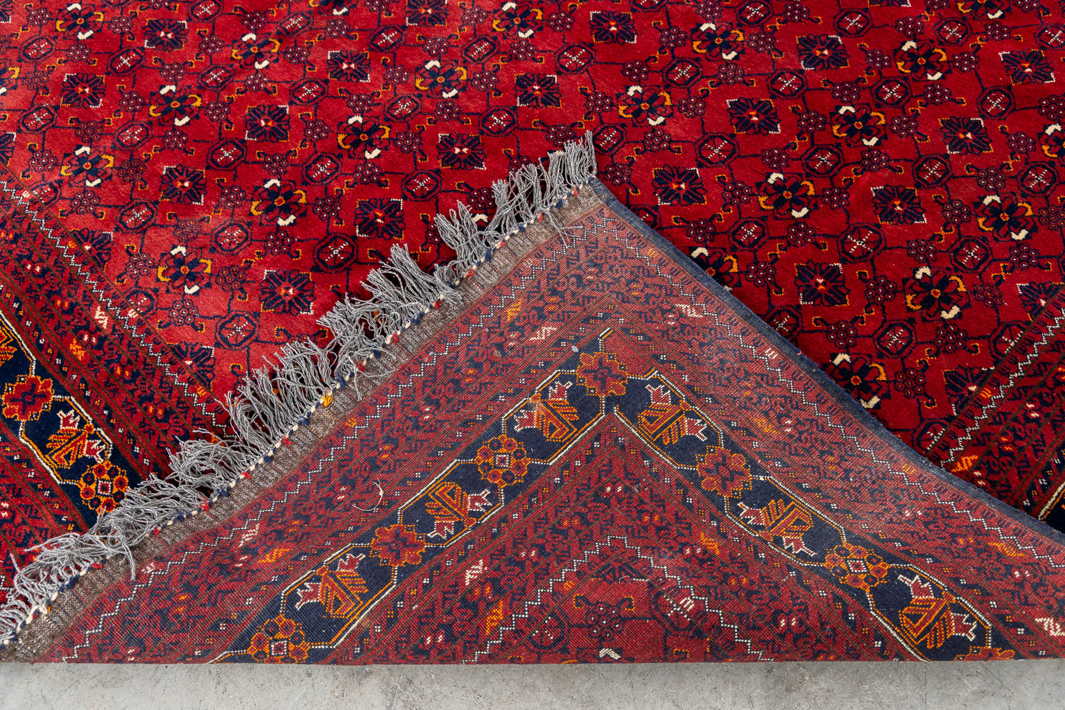 An Oriental hand-made carpet, Afghan. (L:290 x W:193 cm)